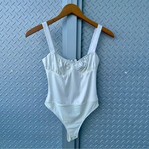 Danielle Bernstein white bustier leotard